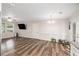 Bright living room with laminate wood floors, white walls and a ceiling fan at 578 Laney Rd, Locust Grove, GA 30248