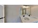 Modern double vanity with black fixtures and bright lighting, showcasing an elegant and functional bathroom space at 6170 Winston Trce, Mcdonough, GA 30252