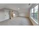 Neutral bedroom offers light gray carpet, light walls, and a window at 6170 Winston Trce, Mcdonough, GA 30252