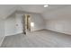 This carpeted bedroom features neutral walls, an overhead light, and two white doors at 6170 Winston Trce, Mcdonough, GA 30252