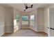 Breakfast nook with hardwood floors, and three large windows at 6170 Winston Trce, Mcdonough, GA 30252