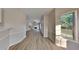Bright foyer with hardwood floors, that leads to the living room and hallway at 6170 Winston Trce, Mcdonough, GA 30252