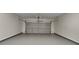 Spacious, freshly painted two-car garage with epoxy flooring and overhead door at 6170 Winston Trce, Mcdonough, GA 30252