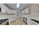 Modern kitchen with white cabinets, stainless steel appliances, and quartz countertops at 6170 Winston Trce, Mcdonough, GA 30252