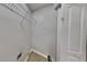 Functional laundry room with wire shelving for storage, a clean design, and easy access at 6170 Winston Trce, Mcdonough, GA 30252