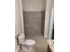 Bathroom showcasing a tile shower and tile flooring, plus neutral tones at 1234 Triple Hill Dr, Macon, GA 30084
