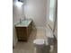 Bathroom featuring a double sink vanity with granite countertops and tile floors at 1234 Triple Hill Dr, Macon, GA 30084