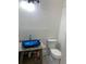 Bathroom featuring granite countertops, a blue vessel sink and modern fixtures at 1234 Triple Hill Dr, Macon, GA 30084
