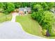 Aerial shot of the property showing a spacious lot, mature trees and the surrounding neighborhood at 3982 Ivory Gables Pl, Buford, GA 30519