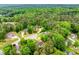 Aerial view of the residence, marked for visibility, highlighting its position within a tranquil, tree-filled neighborhood at 3982 Ivory Gables Pl, Buford, GA 30519