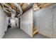 Unfinished basement presents a blank canvas with exposed utilities and framed walls, ready for customization at 3982 Ivory Gables Pl, Buford, GA 30519