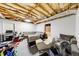 Spacious basement recreation area offers versatile space for entertainment and relaxation with exposed ceiling at 3982 Ivory Gables Pl, Buford, GA 30519