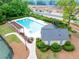 A clean community pool, clubhouse, and tennis courts offer recreation near a developing neighborhood at 3982 Ivory Gables Pl, Buford, GA 30519