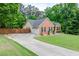 Residential house featuring a lengthy driveway, garage, and well-kept front yard at 3982 Ivory Gables Pl, Buford, GA 30519