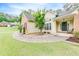 Front yard with manicured landscaping, walkway, and covered entryway at 3982 Ivory Gables Pl, Buford, GA 30519
