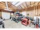 Spacious three car garage with pegboard and exposed wooden supports awaits your projects at 3982 Ivory Gables Pl, Buford, GA 30519