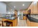 Kitchen featuring wooden cabinets, granite countertops, and stainless steel appliances at 3982 Ivory Gables Pl, Buford, GA 30519
