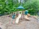 A fun playground with slides and climbing structures is set within a lush, natural environment at 3982 Ivory Gables Pl, Buford, GA 30519