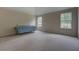 Expansive bedroom with two large windows, vaulted ceiling, and neutral carpeting at 4952 Terrace Dr, Ellenwood, GA 30294