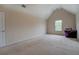 Bedroom features carpet, vaulted ceiling, and one window for natural light at 4952 Terrace Dr, Ellenwood, GA 30294