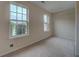 A spare bedroom with carpet, 2 windows, and a closet is ready to be furnished at 4952 Terrace Dr, Ellenwood, GA 30294