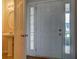 Home entryway showcases the front door, wood floors, and powder room at 4952 Terrace Dr, Ellenwood, GA 30294