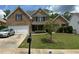 Charming two-story brick home with a well-manicured lawn and a two-car garage in a desirable neighborhood at 4952 Terrace Dr, Ellenwood, GA 30294
