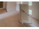 Second floor hallway with carpeted steps and railing at 4952 Terrace Dr, Ellenwood, GA 30294