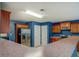 Spacious kitchen with stainless steel refrigerator and ample cabinet and counter space at 4952 Terrace Dr, Ellenwood, GA 30294