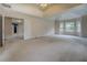Expansive main bedroom with tray ceilings, large windows, and ample space for relaxation and personalization at 4952 Terrace Dr, Ellenwood, GA 30294