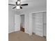 This bedroom features neutral paint, carpet, and access to a closet at 1038 Seven Springs Cir, Marietta, GA 30068