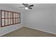 This bedroom features neutral paint, carpet, and natural light from the window at 1038 Seven Springs Cir, Marietta, GA 30068