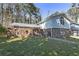 Charming two-story home with a brick facade and well-maintained front lawn at 1038 Seven Springs Cir, Marietta, GA 30068