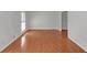 Bright living room boasts gleaming hardwood floors and natural light at 1038 Seven Springs Cir, Marietta, GA 30068
