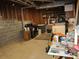 Unfinished basement with exposed pipes and beams and laundry machines at 27 Edgar Ct, Hiram, GA 30141