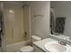 Traditional bathroom with a shower-tub combo, towel racks, and a classic sink setup at 27 Edgar Ct, Hiram, GA 30141