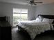 Bright bedroom with large window and ceiling fan; well-lit space and floral comforter at 27 Edgar Ct, Hiram, GA 30141