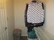 Organized closet with shelves and hanging space; includes laundry baskets and clothing rack at 27 Edgar Ct, Hiram, GA 30141
