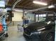 Attached two-car garage featuring auto door opener and storage at 27 Edgar Ct, Hiram, GA 30141