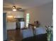 Well-lit kitchen with stainless steel appliances, wooden floors, and white cabinets at 27 Edgar Ct, Hiram, GA 30141