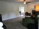 Spacious living room with a fireplace and neutral-toned carpet, ideal for comfortable living at 27 Edgar Ct, Hiram, GA 30141