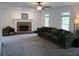 Bright living room with a brick fireplace and a comfortable couch at 27 Edgar Ct, Hiram, GA 30141