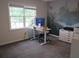 Dedicated office space with a large window view and a unique mural creating a creative atmosphere at 27 Edgar Ct, Hiram, GA 30141