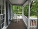Cozy covered porch with rocking chair, perfect for relaxing and enjoying the outdoors at 27 Edgar Ct, Hiram, GA 30141