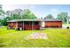 Expansive backyard featuring a brick house with a screened porch, perfect for outdoor relaxation and entertaining at 336 Burnt Hickory Rd, Powder Springs, GA 30127