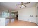 Open living room showcases laminate flooring, multiple ceiling fans, and sunlit windows at 336 Burnt Hickory Rd, Powder Springs, GA 30127