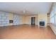 Spacious living room features a fireplace, built-in shelving, and double doors at 336 Burnt Hickory Rd, Powder Springs, GA 30127