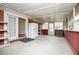 Spacious sunroom with multiple windows, exterior access, and shelving at 336 Burnt Hickory Rd, Powder Springs, GA 30127