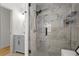 Elegant bathroom featuring a glass enclosed shower with white marble surround and a gray vanity at 94 Glenn Se St, Atlanta, GA 30312