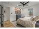 Bright bedroom features a ceiling fan, a double-hung window, and natural light at 94 Glenn Se St, Atlanta, GA 30312